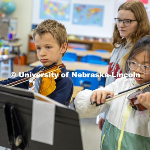 Cassidy Warta, a sophomore music education major, teaches a first-year small group string class in preparation for their concert. UNL/LPS String Project. April 10, 2024. Photo by Kristen Labadie / University Communication.